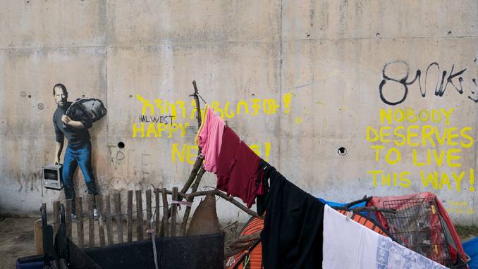 the son of a migrant from Syria // Calais - dec 2015 © Banksy